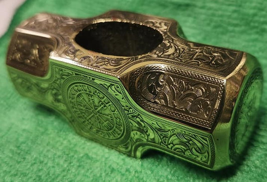 Ornate engraved brass Viking hammer head.